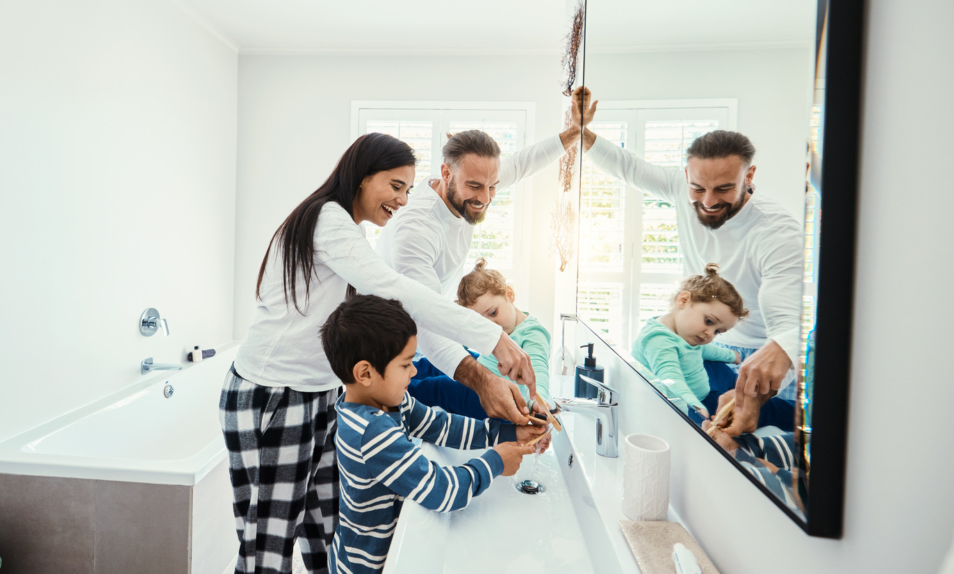 Family, washing hands and bathroom with a mom, father and children with hygiene care in morning. Mo.
